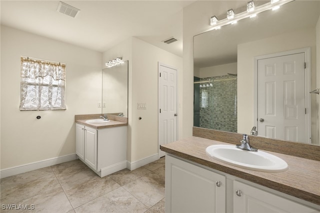 bathroom featuring vanity and a shower with shower door