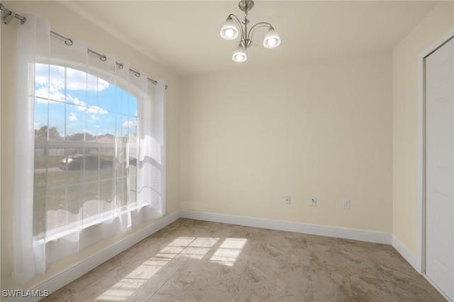 unfurnished dining area featuring a notable chandelier