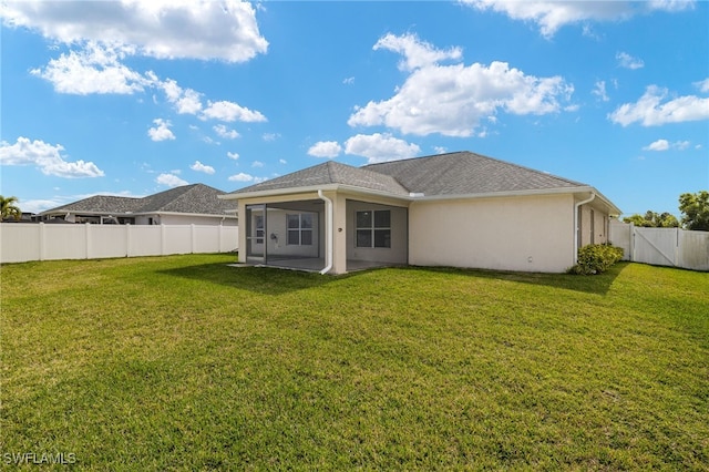 back of house featuring a yard and a patio