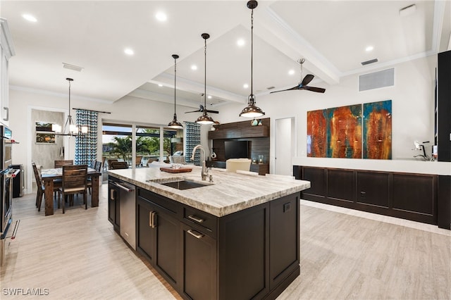 8949 Mustique Ln, Naples, FL 34114 - kitchen with a ceiling fan, light wood-type flooring, recessed lighting, a center island with sink, and beam ceiling