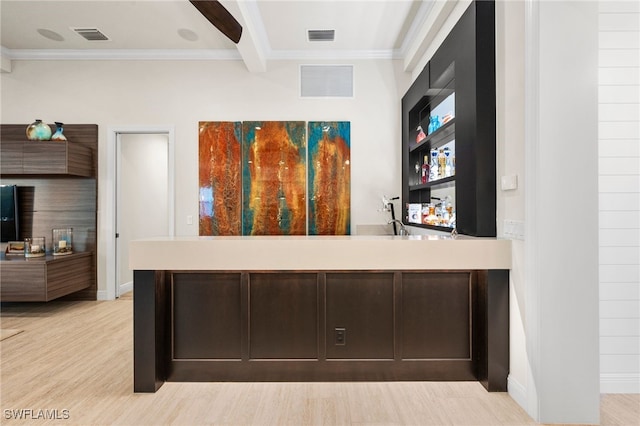 8949 Mustique Ln, Naples, FL 34114 - detailed view of crown molding, a community bar, and wood finished floors