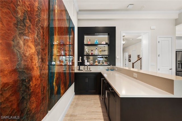 8949 Mustique Ln, Naples, FL 34114 - indoor wet bar with light wood-type flooring, stainless steel fridge with ice dispenser, and crown molding