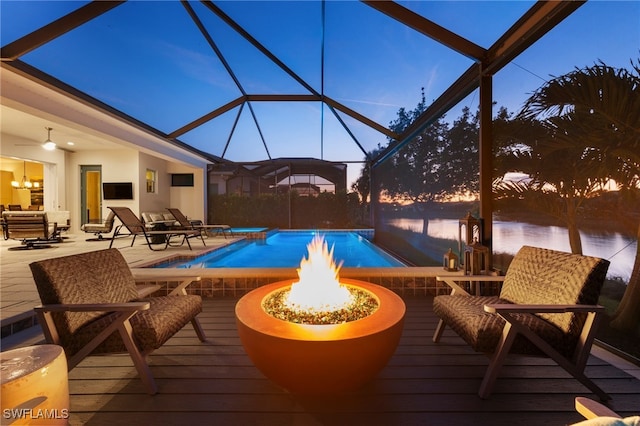 8949 Mustique Ln, Naples, FL 34114 - outdoor pool with a fire pit, a hot tub, glass enclosure, and a deck