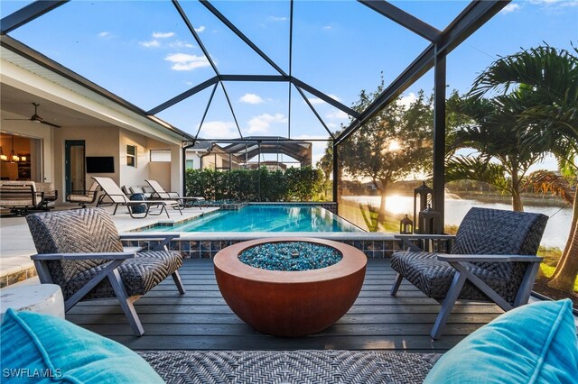 8949 Mustique Ln, Naples, FL 34114 - swimming pool featuring a deck, a ceiling fan, and a lanai