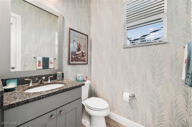 8949 Mustique Ln, Naples, FL 34114 - half bathroom with wallpapered walls and vanity