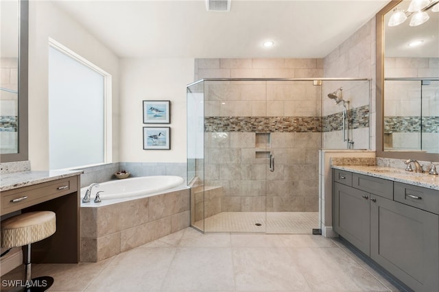 8949 Mustique Ln, Naples, FL 34114 - bathroom with vanity, a bath, a stall shower, and tile patterned floors