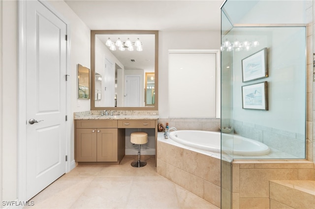 8949 Mustique Ln, Naples, FL 34114 - bathroom featuring vanity, a garden tub, and tile patterned flooring