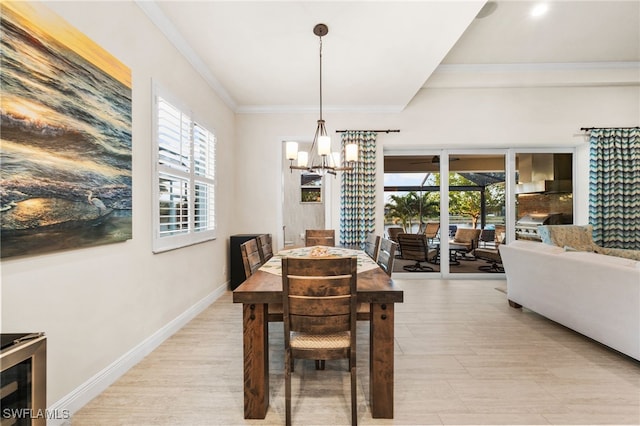 8949 Mustique Ln, Naples, FL 34114 - dining room featuring a chandelier and ornamental molding