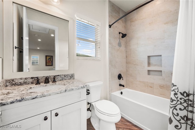 8949 Mustique Ln, Naples, FL 34114 - bathroom featuring vanity, shower / bathtub combination with curtain, and wood finished floors