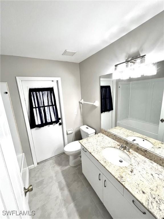 bathroom with vanity and toilet