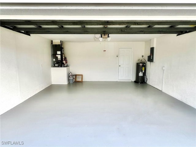 garage with heating unit, a garage door opener, electric panel, and water heater