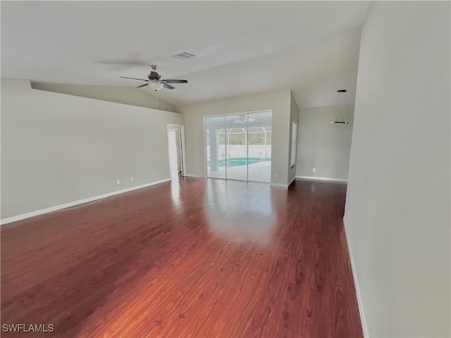 unfurnished room featuring dark wood-type flooring, ceiling fan, and vaulted ceiling