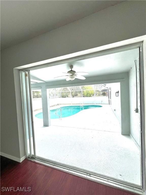 view of swimming pool featuring ceiling fan