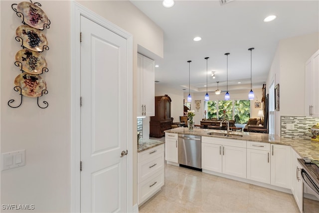 kitchen featuring black range oven, stainless steel dishwasher, a sink, light stone countertops, and open floor plan