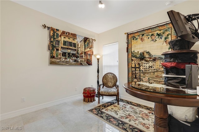 sitting room featuring baseboards