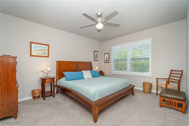 bedroom featuring light carpet and ceiling fan