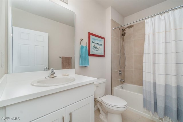 full bathroom featuring tile patterned floors, vanity, toilet, and shower / bath combo with shower curtain