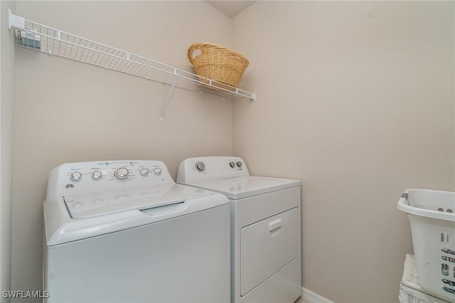 washroom with separate washer and dryer