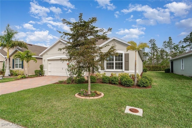 view of front of home featuring a garage and a front yard