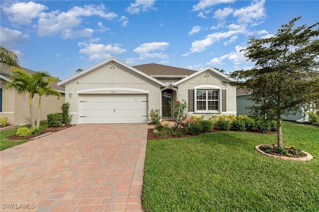 single story home featuring a garage and a front yard