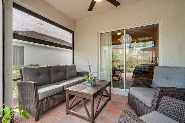 sunroom with ceiling fan and plenty of natural light