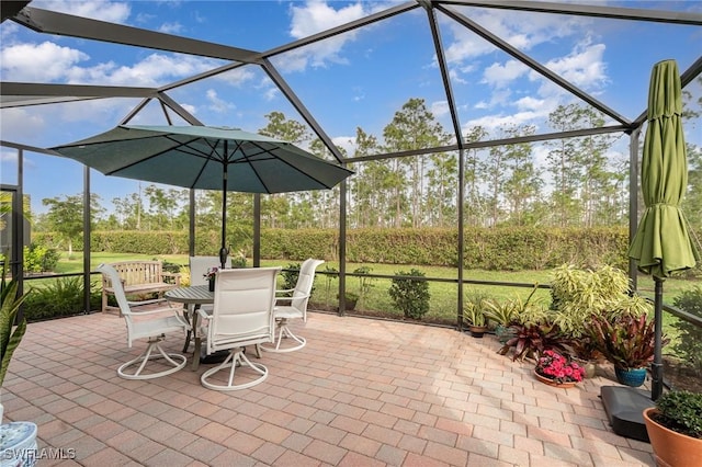 view of patio / terrace featuring a lanai