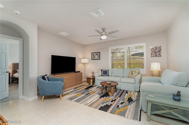 living room with tile patterned floors and ceiling fan