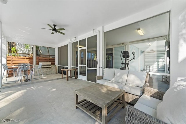 view of patio with an outdoor living space, ceiling fan, and a grill