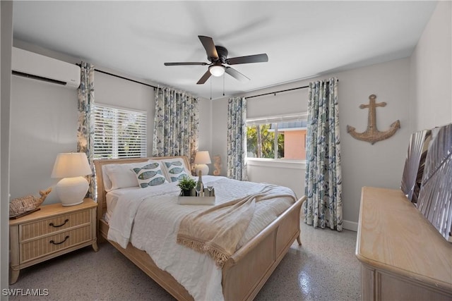 bedroom featuring multiple windows, an AC wall unit, and ceiling fan