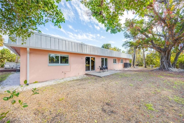 rear view of property featuring a patio area