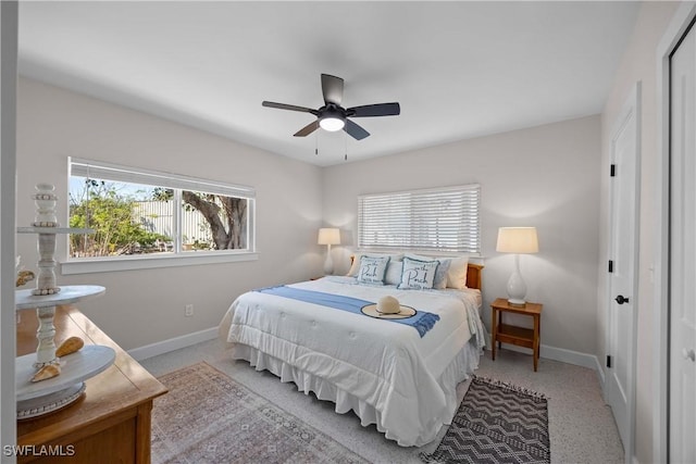 bedroom featuring ceiling fan and multiple windows