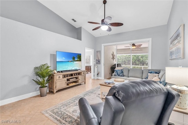 living area featuring visible vents, lofted ceiling, light tile patterned flooring, baseboards, and ceiling fan