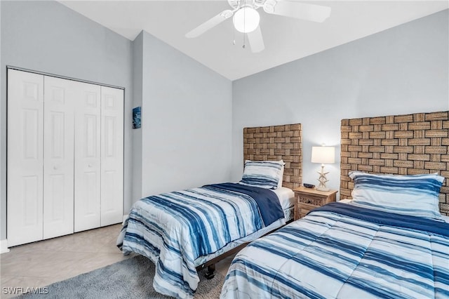 tiled bedroom featuring a closet and ceiling fan