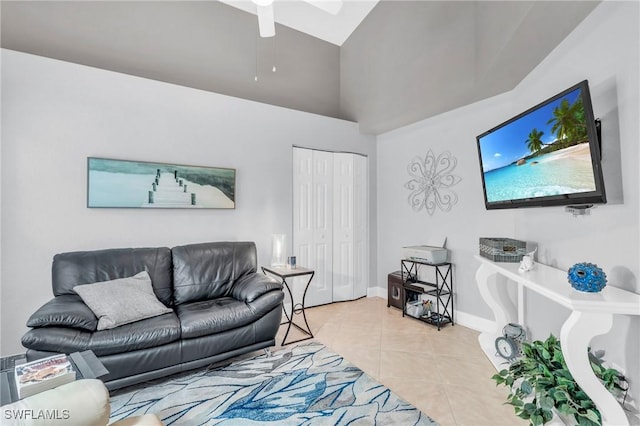 living room featuring lofted ceiling, baseboards, and tile patterned floors