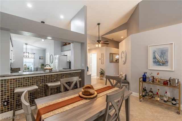 dining room with recessed lighting, vaulted ceiling, ceiling fan, and light tile patterned floors