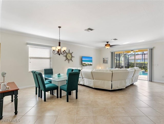 dining space with light tile patterned floors, ceiling fan with notable chandelier, and ornamental molding