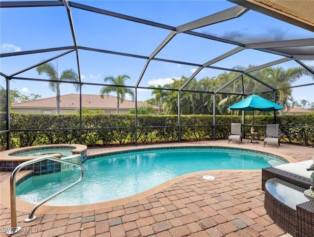 view of swimming pool featuring a patio area, glass enclosure, and an in ground hot tub