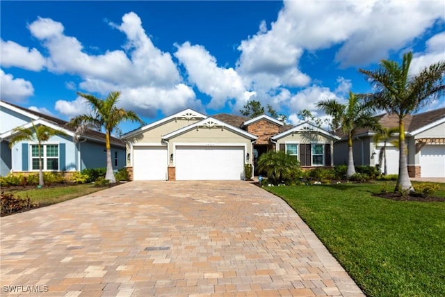 ranch-style home featuring a garage and a front yard