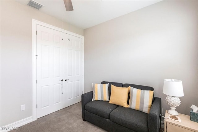 sitting room with light colored carpet