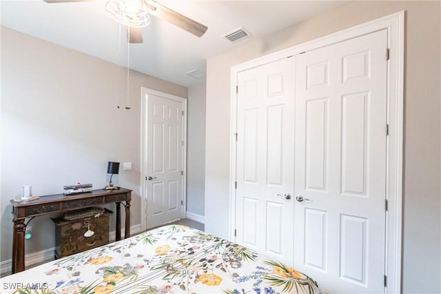 bedroom featuring ceiling fan and a closet