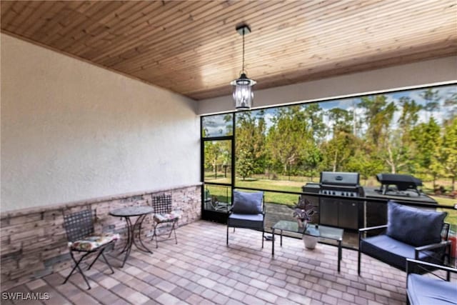 unfurnished sunroom with wooden ceiling