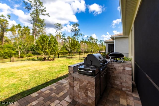 view of patio featuring area for grilling and exterior kitchen