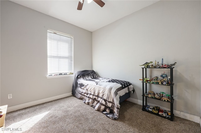 bedroom featuring lofted ceiling, ceiling fan, and carpet