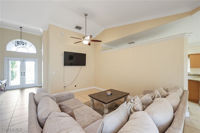 tiled living room with crown molding, high vaulted ceiling, french doors, and ceiling fan