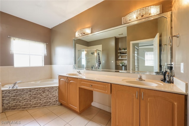 bathroom with tile patterned floors, vanity, and independent shower and bath