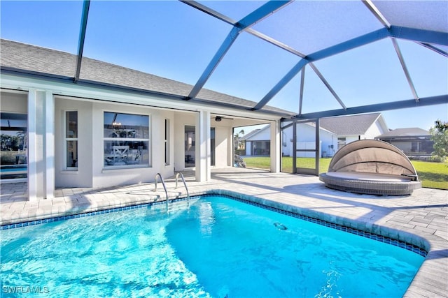 view of pool with a lanai and a patio area