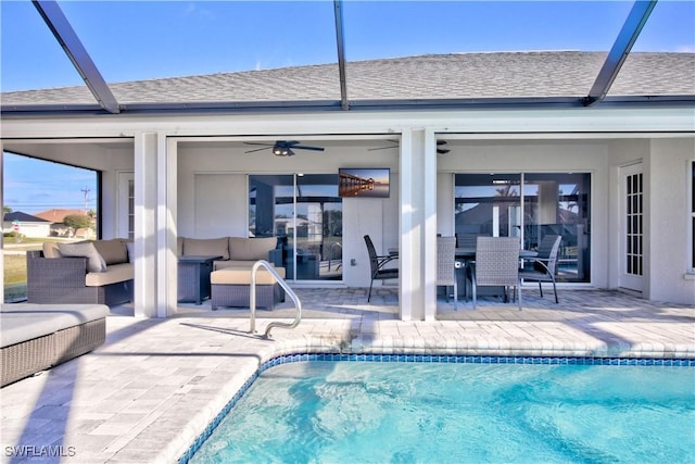 view of swimming pool featuring an outdoor living space, ceiling fan, and a patio area