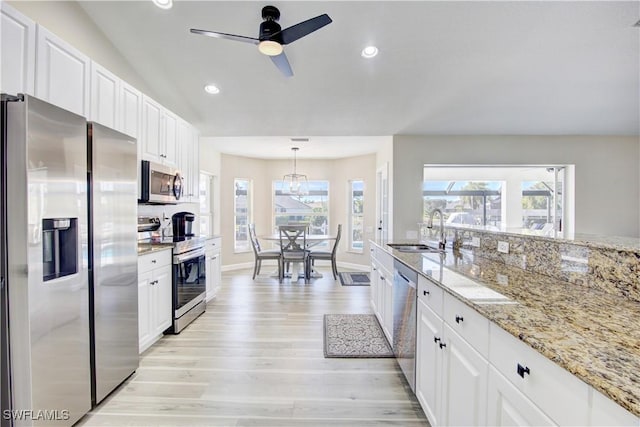 kitchen featuring white cabinetry, sink, and stainless steel appliances