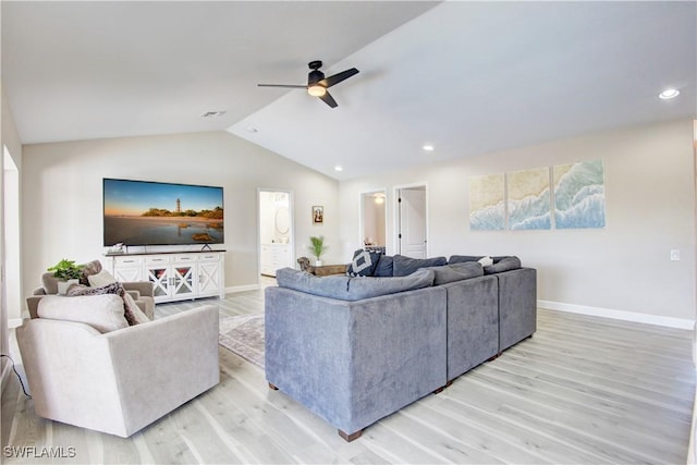 living room with ceiling fan, vaulted ceiling, and light hardwood / wood-style flooring