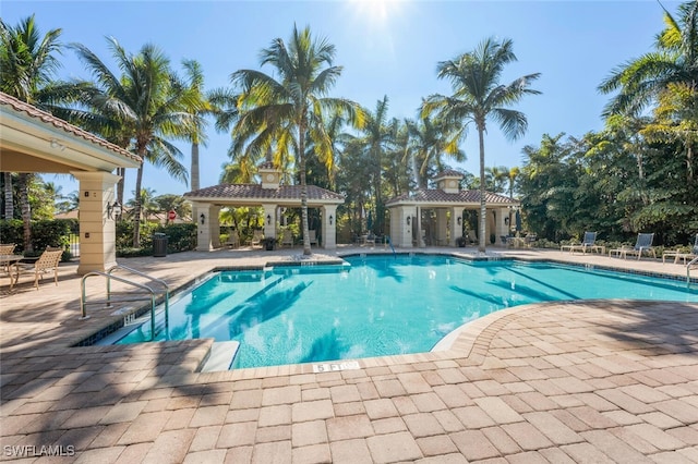 view of swimming pool with a gazebo and a patio area